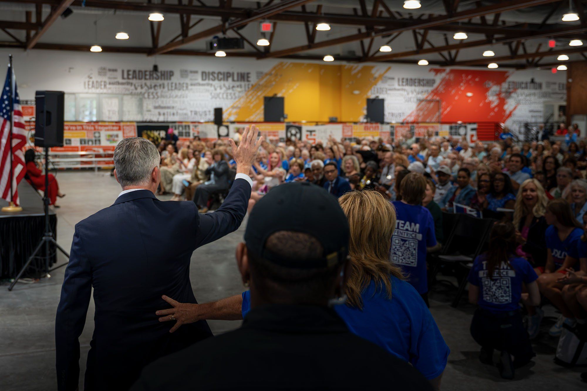 David Jolly waves to a packed room of supporters