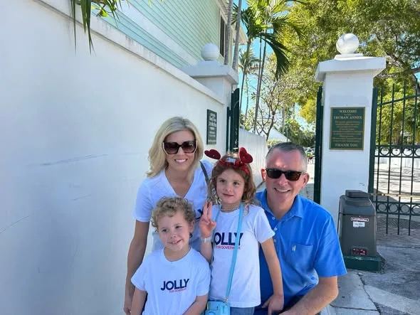 The Jolly family in campaign shirts on a sunny day